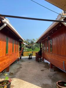 a couple of train cars parked next to each other at Lampang Hideaway Guesthouse in Lampang