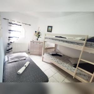 Łóżko lub łóżka w pokoju w obiekcie Deanna Magnifique villa vue mer situé à 1,5 Km de la plage