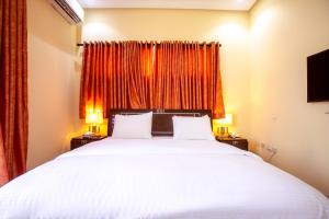 Postel nebo postele na pokoji v ubytování Rushmore - Paradise Room + 5 fotografií