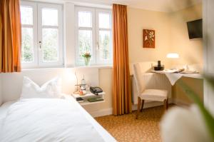 Postel nebo postele na pokoji v ubytování Hotel Waldsee
