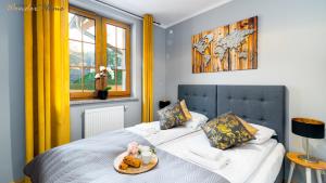 Posteľ alebo postele v izbe v ubytovaní Wonder Home - Apartamenty położone blisko deptaka, licznych restauracji i sklepów