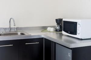 A cozinha ou kitchenette de Hotel Latitud 15