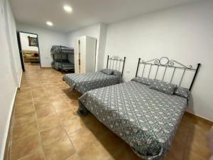 Postel nebo postele na pokoji v ubytování La casa del olivo + 19 fotografií