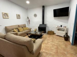 TV a/nebo společenská místnost v ubytování La casa del olivo