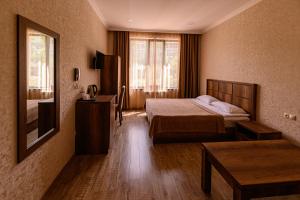 Voodi või voodid majutusasutuse Palermo Hotel toas