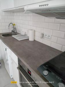 a kitchen with a sink and a counter top at Apartament w samym centrum in Warsaw