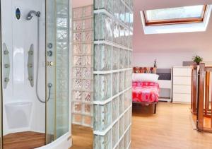 a bathroom with a shower and a glass wall at Casa Donaire in Marganell