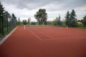 a tennis court with a net on top of it at Zacisze in Ulan