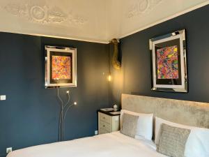 Postel nebo postele na pokoji v ubytování Hôtel Particulier le 28