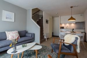 a living room with a couch and a table at Appartement, Kaap 123 - Ameland in Hollum
