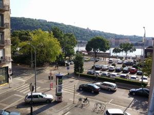 a parking lot with a lot of cars parked at VIP Apartments Budapest in Budapest