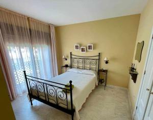 a bedroom with a bed and a large window at E2 equipado en Playa Granada con terraza de 11m2 in Motril +20 photos