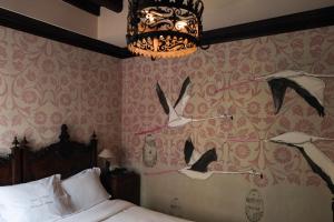 Posteľ alebo postele v izbe v ubytovaní Novecento Boutique Hotel