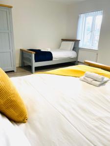 Postel nebo postele na pokoji v ubytování Northern Lodge