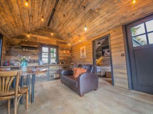 A seating area at Holiday home 'Be Chalet' in the heart of nature in Ferrieres