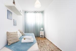Łóżko lub łóżka w pokoju w obiekcie Home2Book Ocean Breeze Candelaria, Terrace & Pool