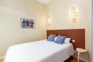 Postel nebo postele na pokoji v ubytování Señor Urgell Apartment by Olala Homes