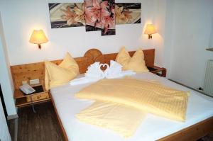 Voodi või voodid majutusasutuse Sieglhub Chalets - Appartements - Hotel toas