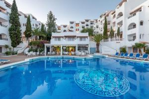 a large swimming pool in front of a building at Holiday Park Santa Ponsa in Santa Ponsa +19 photos