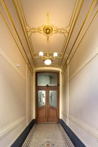 a hallway with a door with a ceiling at Sleep & Go Single Room in Prague