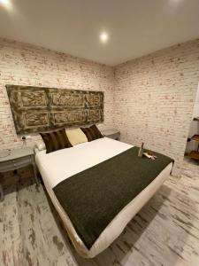 Posteľ alebo postele v izbe v ubytovaní Apartamentos Sevilla Palace