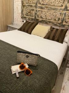 Posteľ alebo postele v izbe v ubytovaní Apartamentos Sevilla Palace
