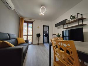 a living room with a couch and a table at Santa Rita Suite in Turin