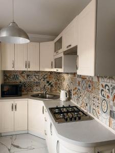 Dapur atau dapur kecil di Апартаменти в центрі Тернополя