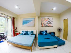 Letto o letti in una camera di Beach Getaway at Pico de Loro Hamilo Coast Nasugbu Batangas