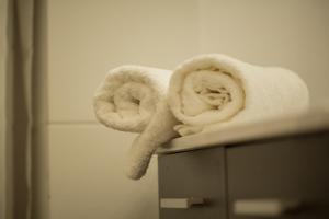 a couple of towels sitting on top of a counter at Apollonio Upper View Suites in Korinthos