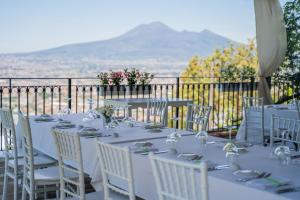 a table set up for a wedding with a view at Villa Palmentiello in SantʼAntonio Abate