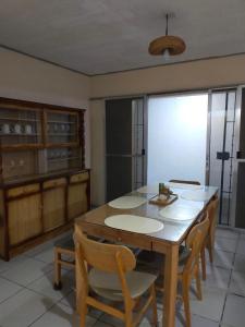 a dining room with a wooden table and chairs at 4 bedroom 2 bath house in Angeles