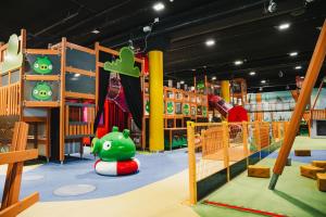 a childrens play area with a slide and a playground at Holiday Club Saimaan Rauha in Imatra