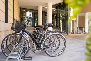 a group of bikes parked next to a building at INNSiDE by Meliá Dresden in Dresden