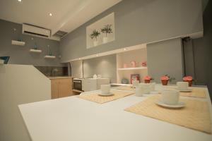 Η κουζίνα ή μικρή κουζίνα στο APOLLONIO Suites