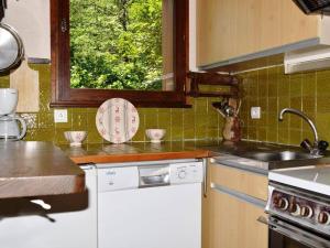 a kitchen with a sink and a counter top at Appartement Le Grand-Bornand, 3 pièces, 6 personnes - FR-1-241-42 in Le Grand-Bornand