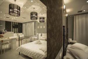 Ένα ή περισσότερα κρεβάτια σε δωμάτιο στο Apollonio Upper View Suites