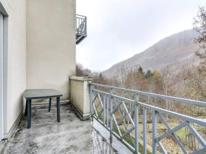 a bench sitting on the balcony of a building at Appartement 6 pers avec balcon et parking à Barèges - FR-1-403-20 in Barèges +5 photos