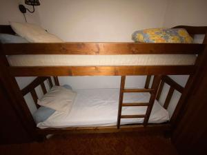a couple of bunk beds in a room at Appartement Le Grand-Bornand, 1 pièce, 4 personnes - FR-1-241-75 in Le Grand-Bornand