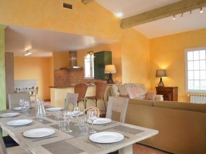 a dining room with a table and a living room at Villa 5 pièces 3 chambres avec jardin, clim, wifi, animaux admis - FR-1-225C-470 in Banyuls-sur-Mer