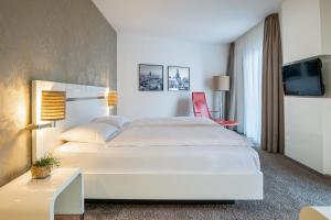 Postel nebo postele na pokoji v ubytování INNSiDE by Meliá Dresden