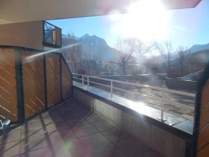 a building with a balcony with a view of the mountains at Appartement Briançon, 2 pièces, 6 personnes - FR-1-330C-29 in Briançon