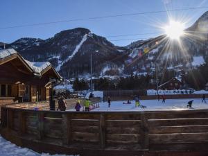 a group of people playing in the snow at a ski slope at Studio fonctionnel avec coin montagne, proche remontées mécaniques et centre commercial, 4 couchages - FR-1-330F-66 in Serre Chevalier +8 photos