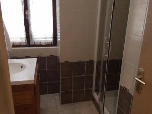 a bathroom with a sink and a shower at Appartement Briançon, 3 pièces, 8 personnes - FR-1-330C-84 in Briançon