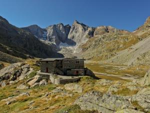 an old building on the side of a mountain at Charmant studio à Cauterets avec balcon, parking couvert et proche télécabine - FR-1-401-24 in Cauterets +8 photos