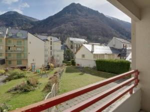 a view from a balcony of a town with a mountain at Charmant studio à Cauterets avec balcon, parking couvert et proche télécabine - FR-1-401-24 in Cauterets