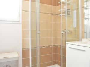a bathroom with a shower with a toilet and a sink at Appartement moderne 2 chambres avec terrasse, parking et climatisation à Banyuls-sur-Mer - FR-1-225C-531 in Banyuls-sur-Mer +8 photos