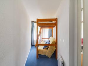 a small room with a bunk bed in a house at Appartement La Mongie, 2 pièces, 5 personnes - FR-1-404-57 in La Mongie