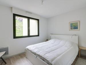 Ένα ή περισσότερα κρεβάτια σε δωμάτιο στο Appartement pour 8, 2 chambres, centre station, 3ème étage, sécurisé, casier à ski - FR-1-404-74
