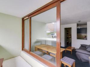 a room with a table and a living room at Studio 5 pers avec lave-linge proche pistes - La Mongie - FR-1-404-105 in La Mongie +9 photos